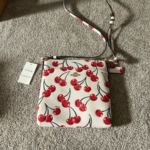 Coach purse with sparkly cherries